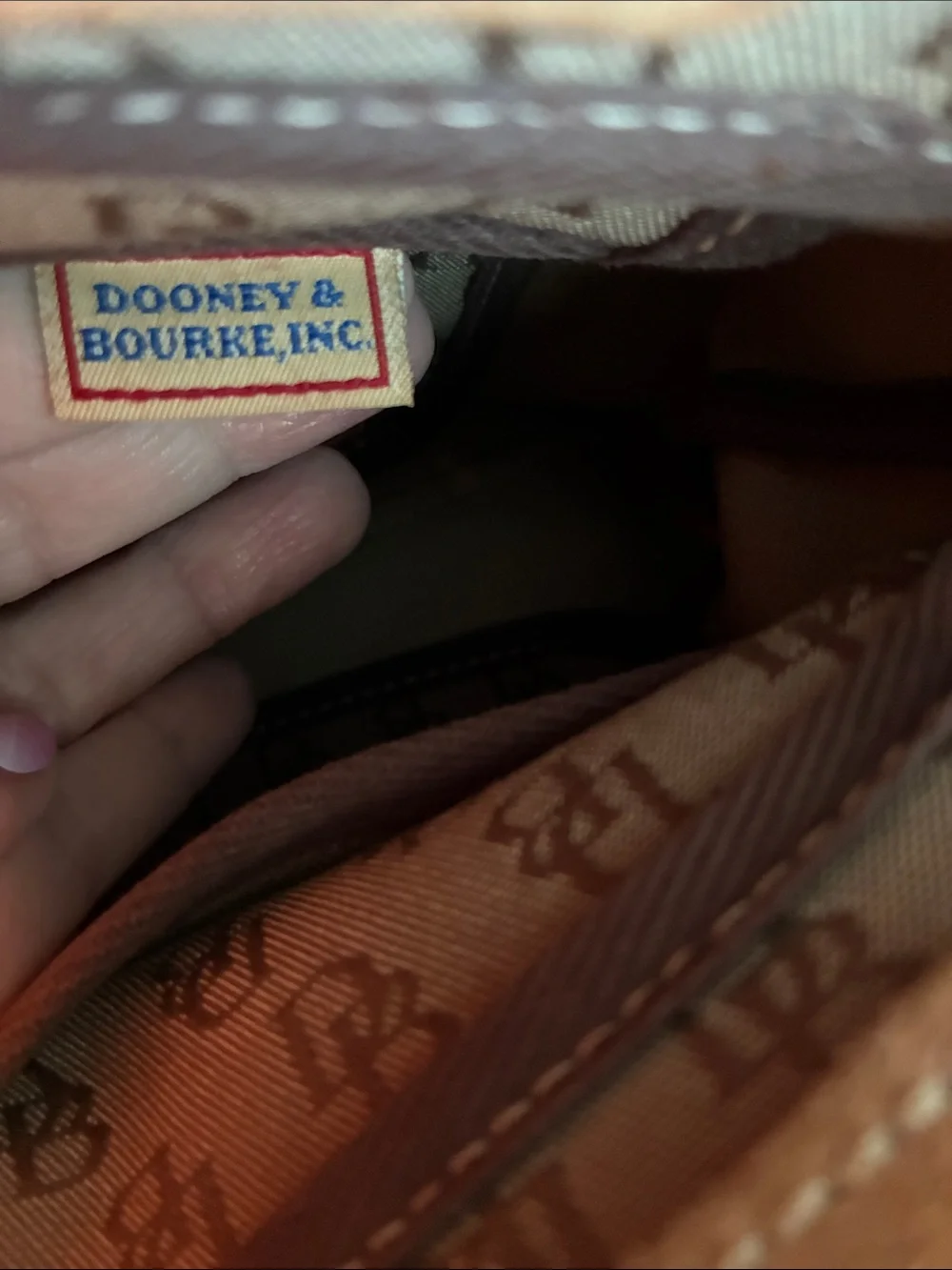 Dooney & Bourke  Brown Monogram Handbag with Tassel Accent